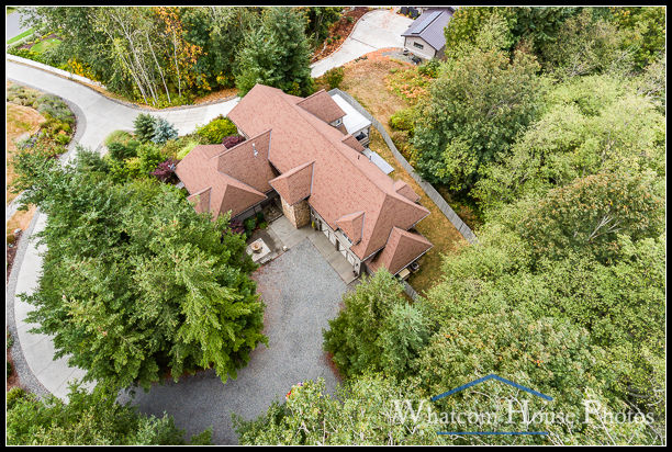 Aerial view of home nestled among trees